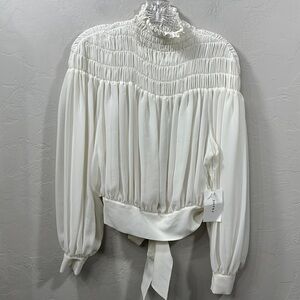 Frame smocked tie back long sleeved chiffon blouse size small. NWT.Flaw